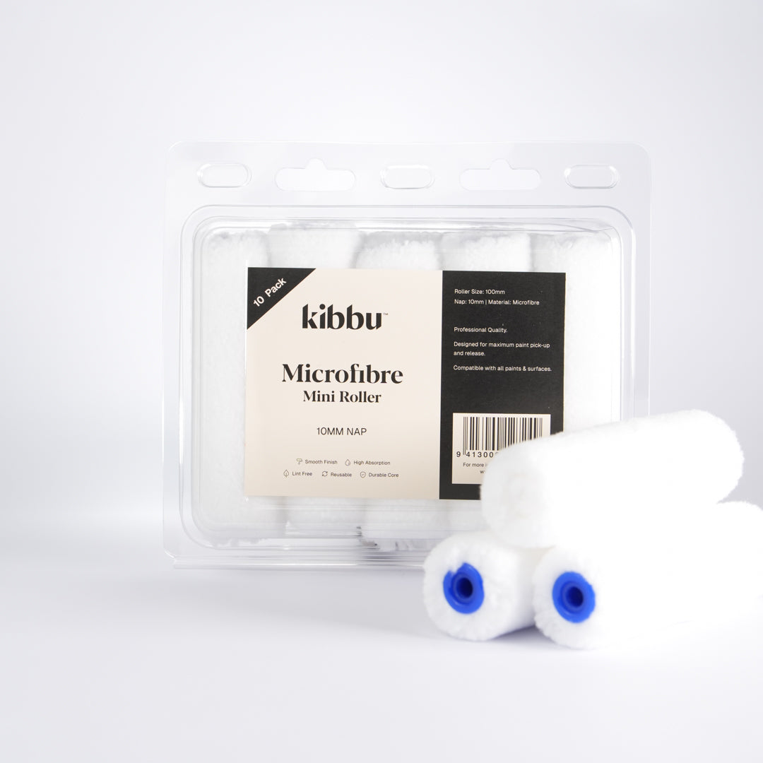 Kibbu microfibre mini roller set in clear plastic packaging with three loose 10mm nap mini rollers on a white background